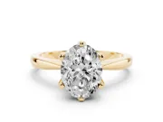 Oval Cut Diamond Solitaire Engagement Ring Set in Yellow gold with Slim Tapered Solitaire Band