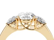 Three-Stone Oval Cut Diamond Ring Set in Yellow gold with Matching Prong Settings and Plain Band