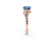 Fancy Blue Radiant Cut Diamond Solitaire Ring Set in Rose gold with Marquise Twist Band and Prong Setting