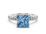 Fancy Blue Princess Cut Diamond Solitaire Pavé Engagement Ring Set in White gold with Round Band and Prong Setting