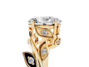 Oval Cut Diamond Solitaire Twist Engagement Ring Set in Yellow gold with Pavé Leaf Accents