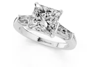 Princess Cut Diamond Solitaire Ring Set in Platinum with Tapered Baguette Side Stones and Prong Setting