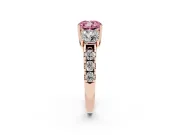 Fancy Pink Cushion Cut Diamond Three-Stone Ring Set in Rose gold with Pavé Band