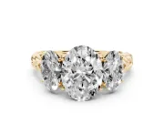 Oval Cut Diamond Three-Stone Ring Set in Yellow gold with Braided Band