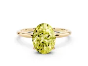 Fancy Yellow Oval Cut Diamond Solitaire Engagement Ring Set in Yellow gold with Thin Band and Prong Setting