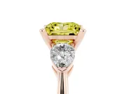 Fancy Yellow Three-Stone Princess Cut Diamond Ring Set in Rose gold with Pear Side Stones and Prong Setting