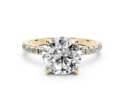 Round Cut Diamond Brilliant Solitaire Ring Set in Yellow gold with Pavé Band and Prong Setting