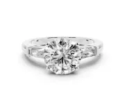 Round Cut Diamond Solitaire Ring Set in White gold with Tapered Baguette Side Stones and Prong Setting