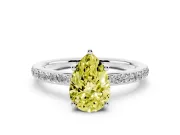 Fancy Yellow Pear Cut Diamond Pavé Band Ring Set in White gold with Prong-Set Center Stone