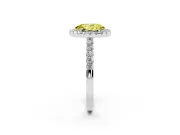 Fancy Yellow Oval Cut Diamond Halo Pavé Solitaire Ring Set in White gold with Prong-Set Center Stone