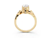 Oval Cut Diamond Solitaire Twist Engagement Ring Set in Yellow gold with Pavé Leaf Accents