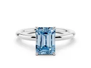 Fancy Blue Emerald Cut Diamond Solitaire Ring Set in White gold with Thin Band and Prong Setting