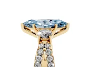 Fancy Blue Marquise Cut Diamond Three-Stone Ring Set in Yellow gold with Pavé Split Shank and Prong Setting