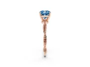 Fancy Blue Cushion Cut Diamond Solitaire Ring Set in Rose gold with Twisted Band and Bead Prong Setting