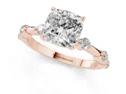 Cushion Cut Diamond Solitaire Ring Set in Rose gold with Bezel Set Side Stones and Prong Setting