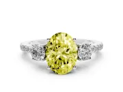 Fancy Yellow Oval Cut Diamond Three-Stone Ring Set in Silver with Pavé Band and Graduated Sides