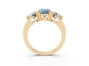 Fancy Blue Oval Cut Diamond Three-Stone Ring Set in Yellow gold with Prong Setting and Classic Band