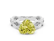 Fancy Yellow Heart Cut Diamond Twist Band Solitaire Ring Set in Platinum with Leaf Prong Setting and Accent Stones