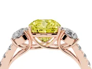 Fancy Yellow Cushion Cut Diamond Three-Stone Ring Set in Rose gold with Round Side Stones and Delicate Pavé Band