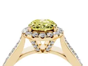 Fancy Yellow Oval Cut Diamond Halo Ring Set in Yellow gold with Pavé Band and Raised Center Setting
