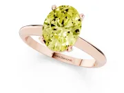 Fancy Yellow Oval Cut Diamond Solitaire Ring Set in Rose gold with Prong Setting on a Plain Round Band