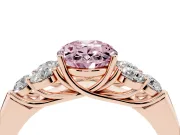 Fancy Pink Oval Cut Diamond Cluster Ring Set in Rose gold with Round Accent Stones and Prong Setting on a Plain Band