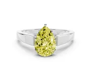 Fancy Yellow Pear Cut Diamond Solitaire Engagement Ring Set in Platinum with Prong Setting and Tapered Band