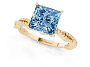Fancy Blue Princess Cut Diamond Solitaire Ring Set in Yellow gold with Twisted Band and Bead Prong Setting