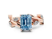 Fancy Blue Emerald Cut Diamond Solitaire Ring Set in Rose gold with Twisted Marquise Accent Band