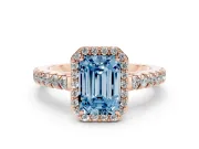 Fancy Blue Emerald Cut Diamond Halo Engagement Ring Set in Rose gold with Pavé Band and Prong Setting