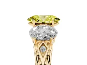 Fancy Yellow Oval Cut Diamond Three-Stone Ring Set in Yellow gold with Braided Band