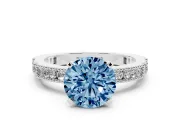 Fancy Blue Round Cut Diamond Solitaire Ring Set in Silver with Slim Pavé Band and Prong Setting