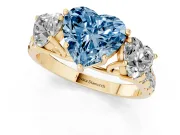 Fancy Blue Heart Cut Diamond Three-Stone Ring Set in Yellow gold with Pavé Band