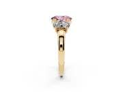 Fancy Pink Oval Cut Diamond Three-Stone Ring Set in Yellow gold with Polished Band and Prong Setting
