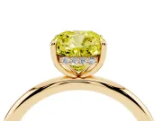 Fancy Yellow Cushion Cut Diamond Solitaire Ring Set in Yellow gold with Thin Band and Prong Setting