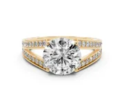 Round Cut Diamond Split Shank Ring Set in Yellow gold with Pavé Band and Prong Setting