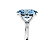 Fancy Blue Oval Cut Diamond Solitaire Engagement Ring Set in White gold with Thin Band and Prong Setting