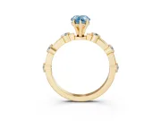 Fancy Blue Pear Cut Diamond Solitaire Ring Set in Yellow gold with Bezel Set Side Stones and Prong Setting