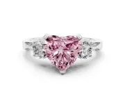 Fancy Pink Heart Cut Diamond Three-Stone Ring Set in Platinum with Pavé Band and Smaller Side Stones