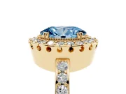Fancy Blue Oval Cut Diamond Halo Ring Set in Yellow gold with Pavé Shank and Prong Setting