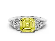 Fancy Yellow Asscher Cut Diamond Cluster Ring Set in Platinum with Round Accent Stones and Prong Setting on a Plain Band