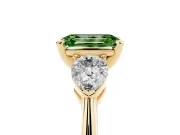 Fancy Green Three-Stone Emerald Cut Diamond Ring Set in Yellow gold with Pear Side Stones and Prong Setting