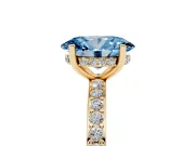 Fancy Blue Oval Cut Diamond Pavé Band Ring Set in Yellow gold with Prong-Set Center Stone