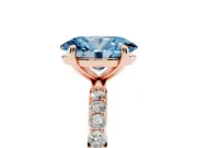 Fancy Blue Oval Cut Diamond Solitaire Ring Set in Rose gold with Round Pavé Band and Prong Setting