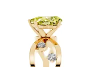 Fancy Yellow Pear Cut Diamond Solitaire Ring Set in Yellow gold with Side Stones on Criss-Cross Band and Prong Setting