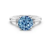 Fancy Blue Three-Stone Round Cut Diamond Ring Set in Platinum with Prong Setting and Plain Band