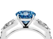Fancy Blue Round Cut Diamond Engagement Ring Set in White gold with Baguette Side Stones and Channel Set Band