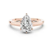 Pear Cut Diamond Solitaire Engagement Ring Set in Rose gold with Prong Setting on a Classic Band