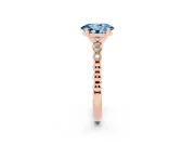 Fancy Blue Oval Cut Diamond Solitaire Engagement Ring Set in Rose gold with Bezel Accents on Beaded Band