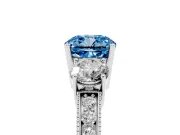 Fancy Blue Cushion Cut Diamond Three-Stone Ring Set in Platinum with Round Side Stones and Pavé Band